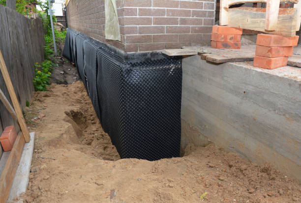 Happy homeowners after waterproofing job in Lewisville